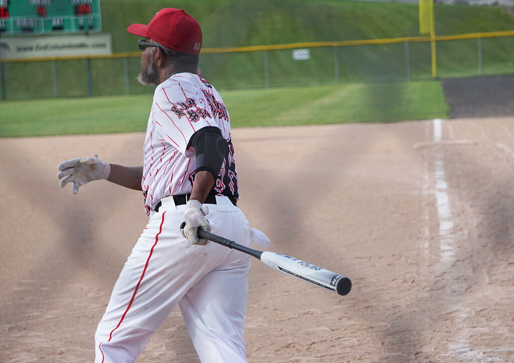 Keith Wilson hits the softball